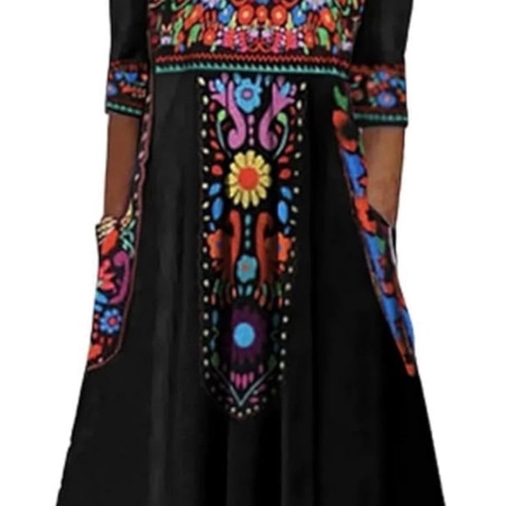 NWOT, Never worn. Chic, bohemian vibrant black dress with pockets.